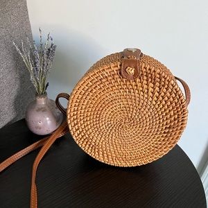 Woven circle rattan crossbody bag with floral interior